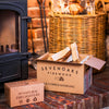 Box of Sevenoaks Firewood kindling  and firelighters in front of a fireplace.