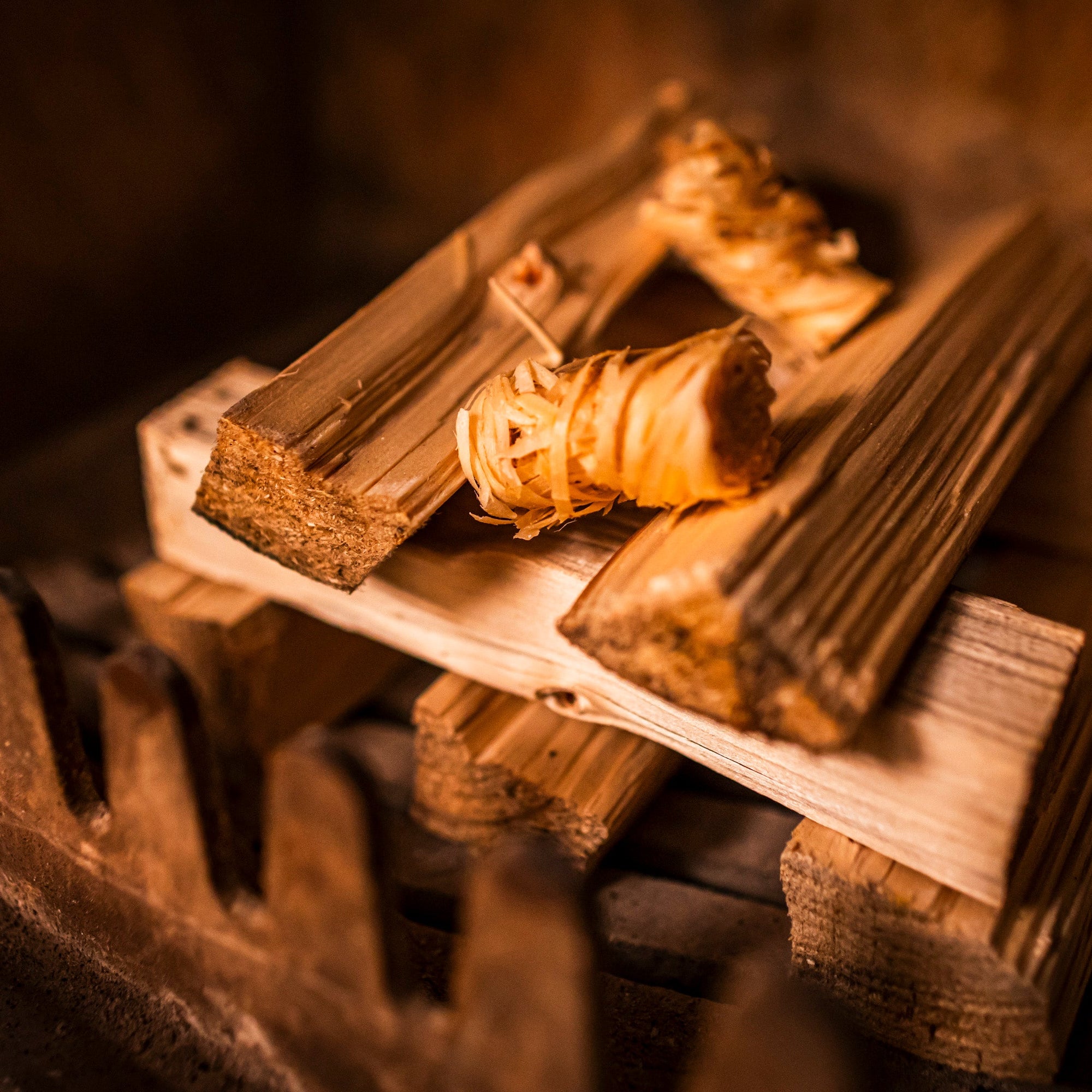 Sevenoaks Firewood kiln dried kindling with firelighters in fire grate.